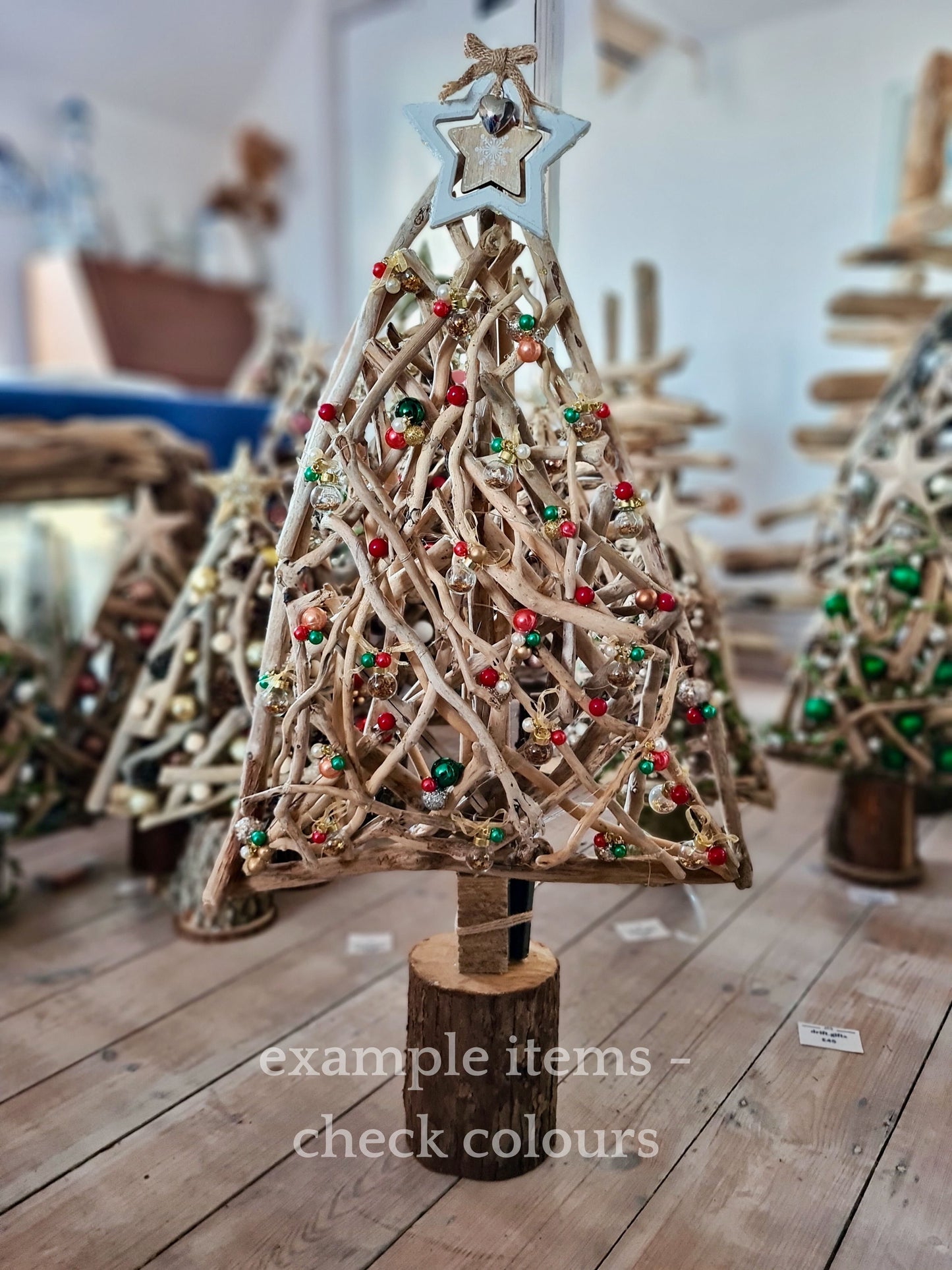 Handmade driftwood Christmas tree with festive baubles