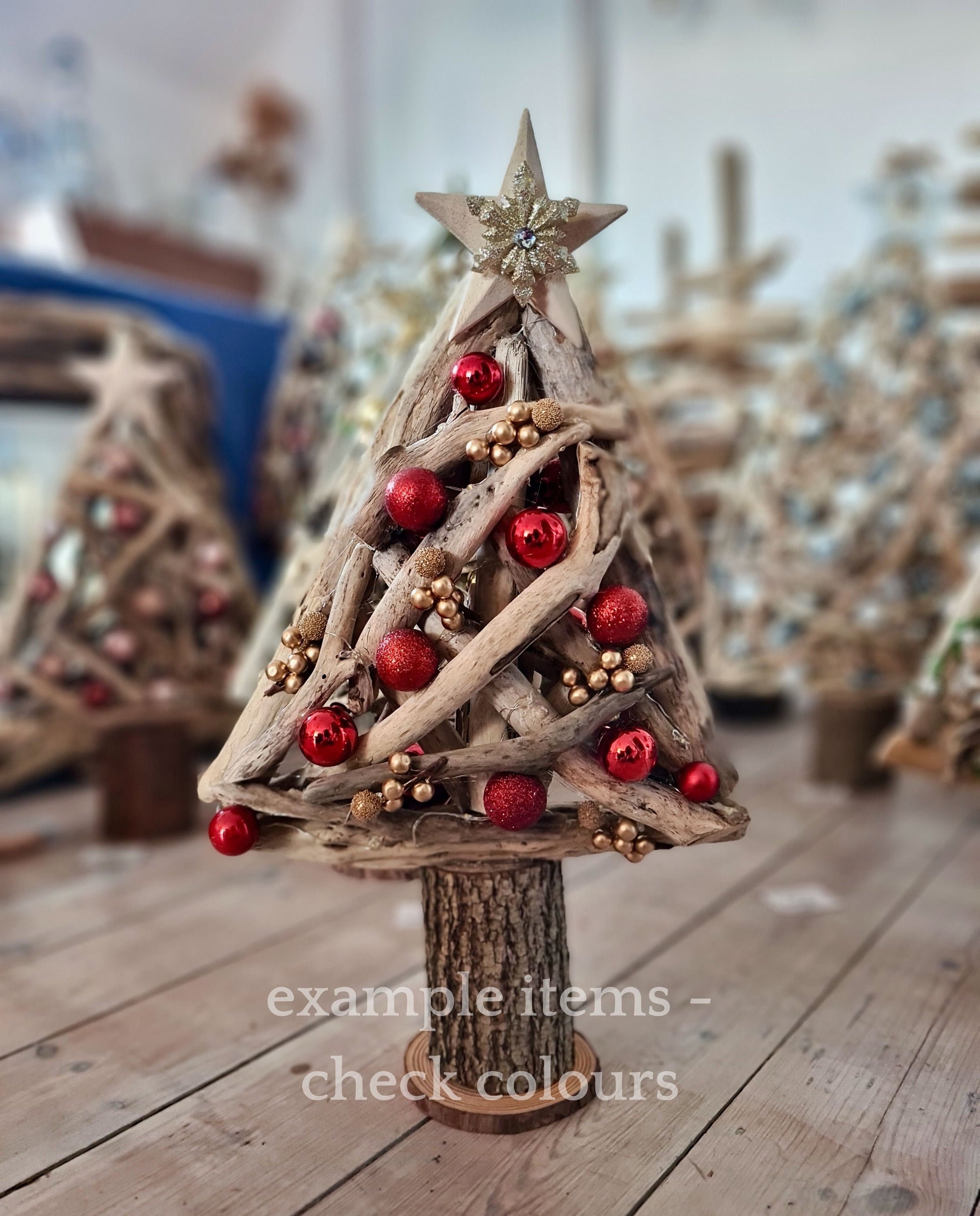 Handmade driftwood Christmas tree decorated with red baubles
