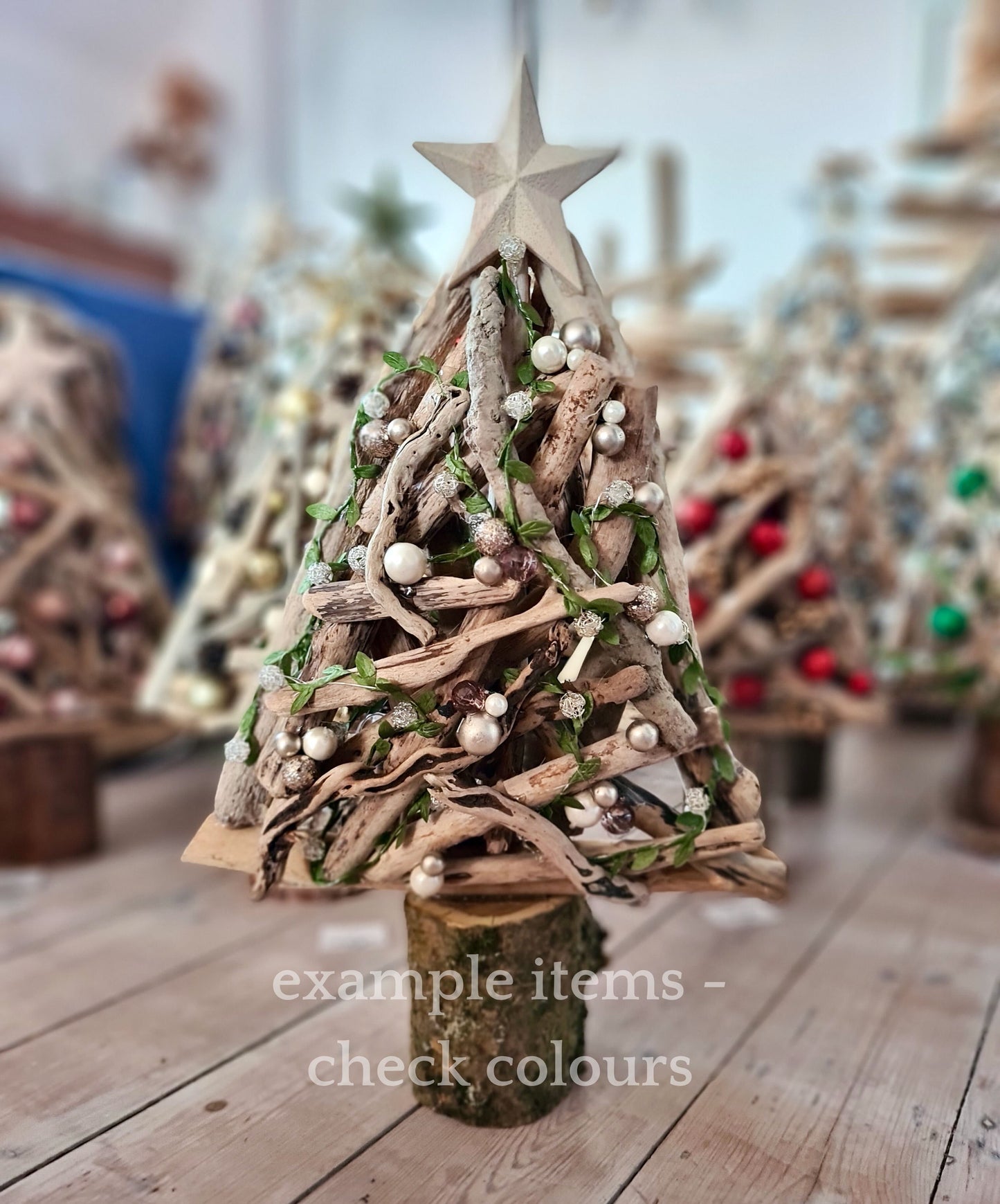 Handmade driftwood Christmas tree decorated with baubles and vines
