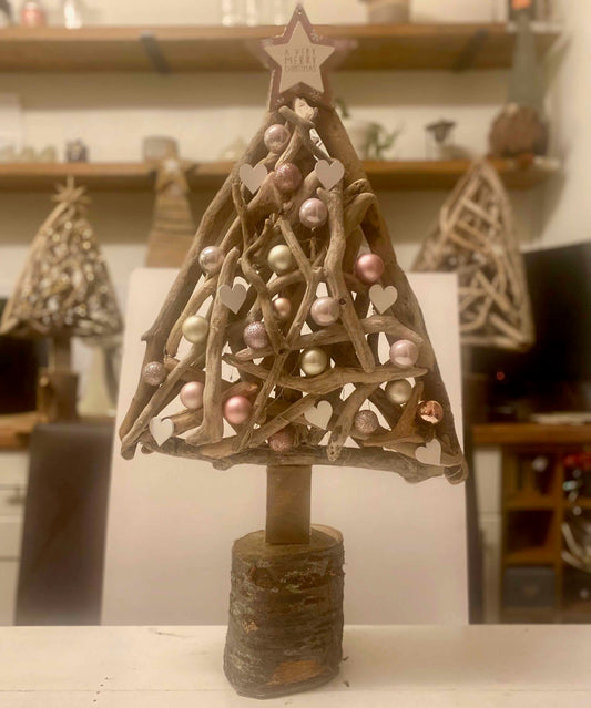 Handmade driftwood Christmas tree with lights and pink silver baubles