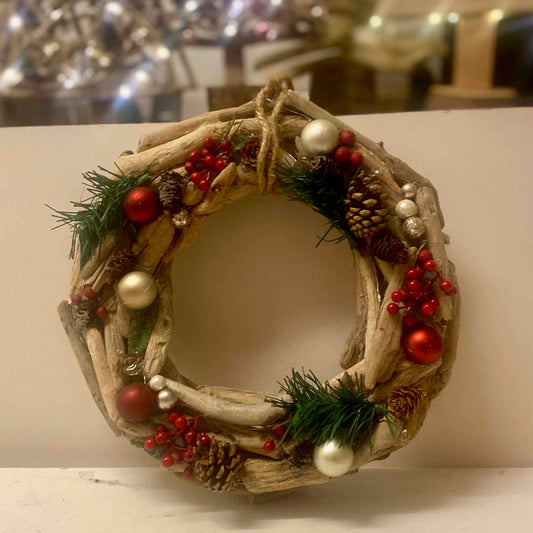Handmade driftwood Christmas wreath with holly and lights