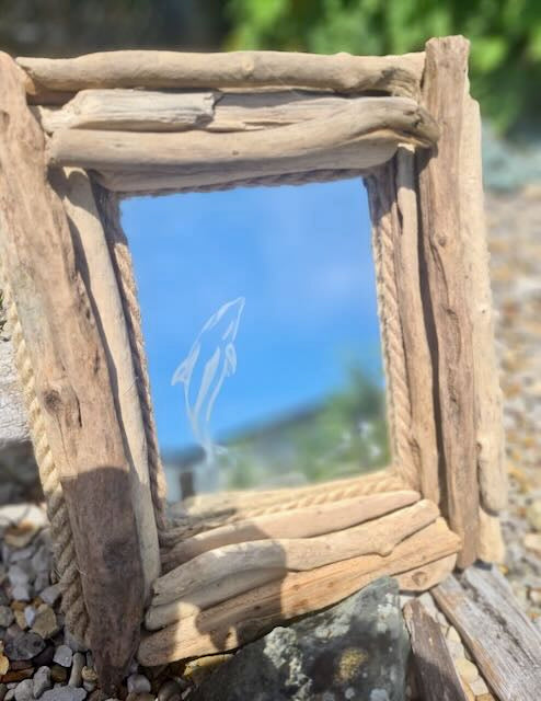 dolphin mirror clad with driftwood